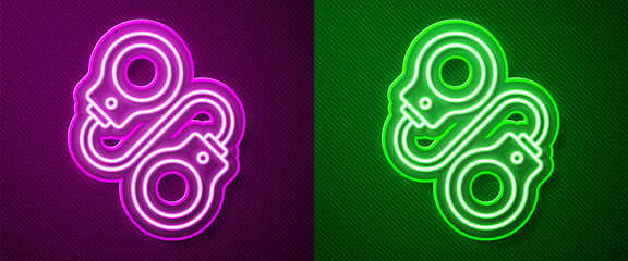 Glowing neon line Handcuffs icon isolated on purple and green background. Vector