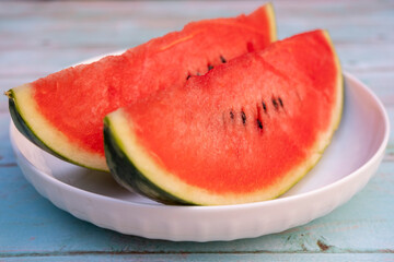 Watermelon slices on a white plate