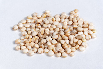 white quinoa seeds close up macro isolated on white background