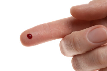 Woman with pricked finger and blood drop on white background, closeup