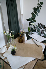 The artist's room. A table for the painter work. Brushes and drawing tools