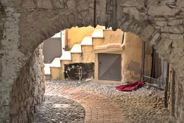 View through an archway in an old village in italy
