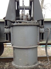 mechanism of unloading a freight train. Pneumatic cylinder of the mechanism of overturning the body of the freight car of the train. - 442906660