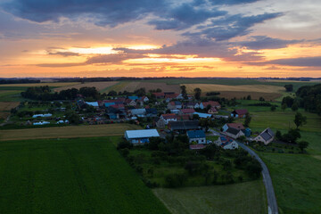 Village from drone aerial view. Beautiful village with houses and fields in Nysa, Poland. Polish farmland