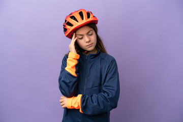 Little caucasian girl isolated on purple background with headache