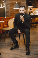 Stylish businessman in a black suit