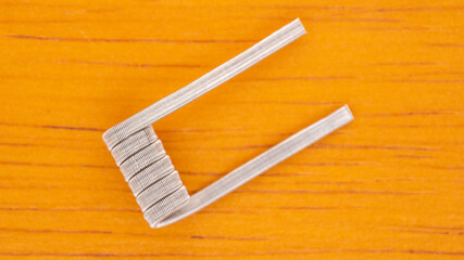 close up, closeup, macro shot of prebuilt triple core fused clapton coil, fancy coil, art coil on...