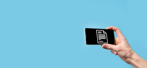 Male hand holding a document icon on blue background. Document Management Data System Business...