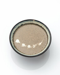 Champignon soup puree, Mushroom cream soup. Clay Bowl of vegetarian Healthy eating isolated on white background. Copy space.