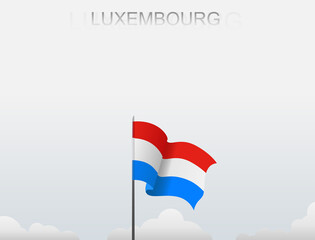 Luxembourg flag flutters on a pole standing tall under a white sky
