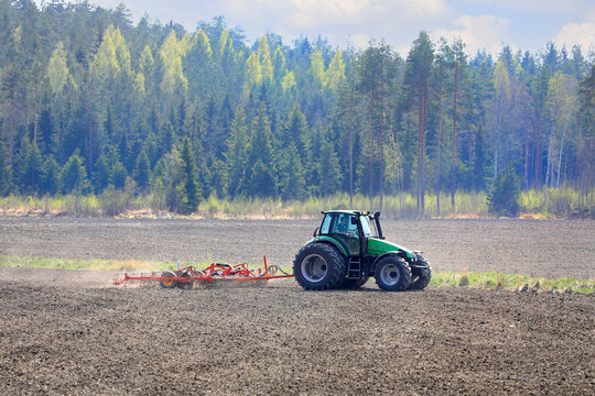 Deutz-Fahr Tractor and Harrow in Field