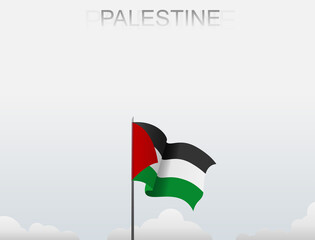 Palestine flag flutters on a pole standing tall under a white sky