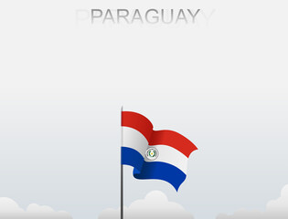 Paraguay flag flutters on a pole standing tall under a white sky