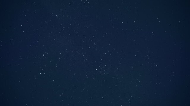 Beautiful view of falling stars on a night blue sky.