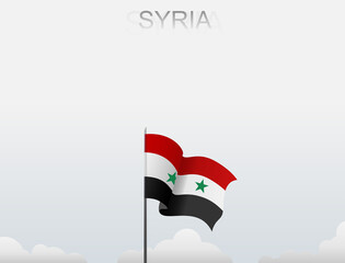 Syrian flag flutters on a pole standing tall under a white sky