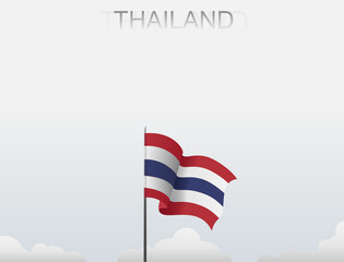 Thailand flag flutters on a pole standing tall under a white sky