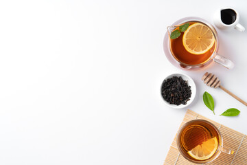 Design concept top view of honey black tea with lemon and mint.