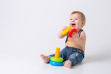 toddler baby boy with toy on white background