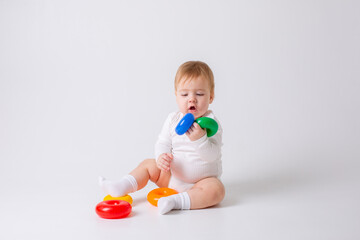 toddler boy with toy on white background