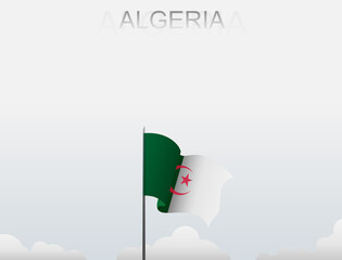 Algerian flag flutters on a pole standing tall under a white sky