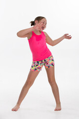 A youg girl doing dance exercise with lots of energy.