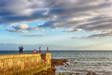 persons locking on the sea