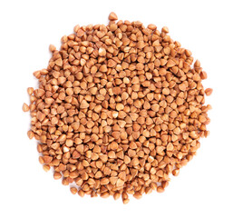 Roasted buckwheat grains, isolated on white background. Dry brown buckwheat groats. Top view.