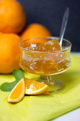 Orange jam with orange_and mint in a glass ambience