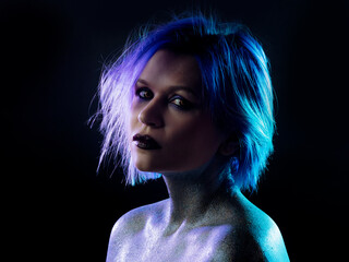 Portrait of a stylish and daring young woman with purple hair