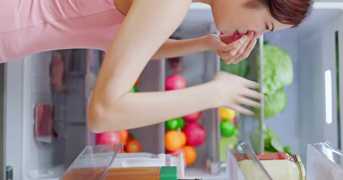 woman open refrigerator
