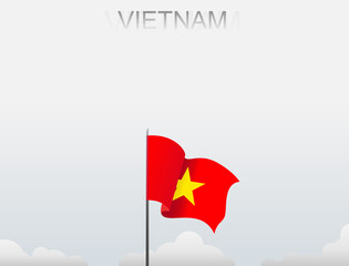 Vietnam flag flutters on a pole standing tall under a white sky