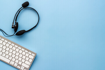 Voip headset and computer laptop on offise desk. Commenication it support call center