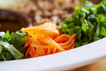 bowl of salad on a wooden table