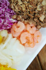 bowl of salad on a wooden table