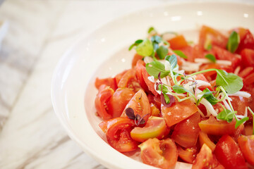 Tomato basil salad on a plate 