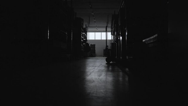Empty closed facility storage warehouse at night dark abandoned facilities store shopping trading trade amazon shop shelf pandemic start up entrepreneur cargo service postal economy heavy equipment