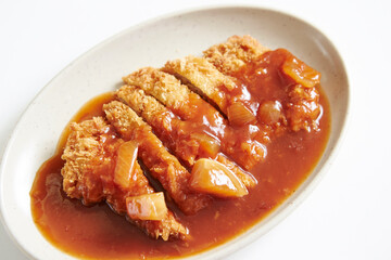 Pork cutlet with delicious sauce on a plate