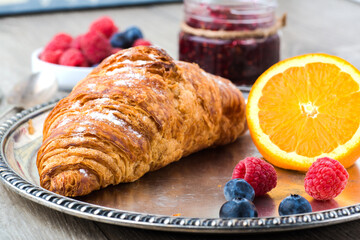 croissants with orange and raspberry jam