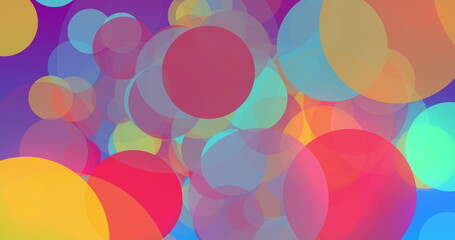 Multicoloured circles moving and multiplying to fill a graduated blue background