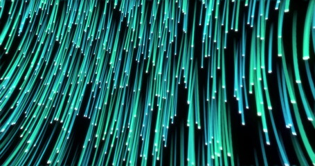 Green and blue fibre strands moving seamlessly downwards on black background