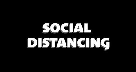 Social distancing text dissolving against black background