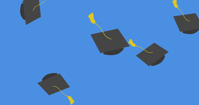 Image of graduation college university hats falling on blue background