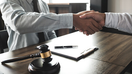 lawyer handshake with client. Business partnership meeting successful concept.