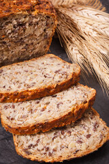 Wholegrain bread for breakfast and ears of rye or wheat grain
