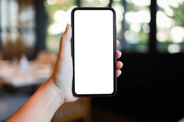 Women's hands holding cell telephone blank copy space screen. smart phone with technology concept