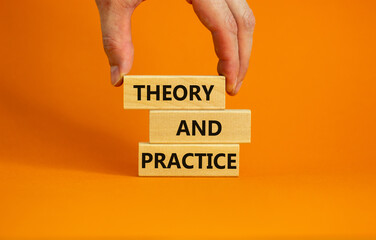 Theory and practice symbol. Wooden blocks with words 'Theory and practice' on a beautiful orange background. Businessman hand. Business, theory and practice concept. Copy space.