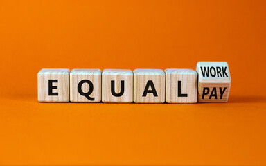 Equal pay and work symbol. Turned the wooden cube and changed words equal pay to equal work....