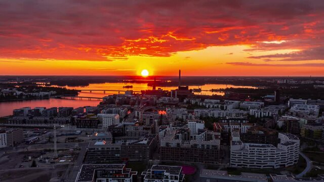 Aerial view of the Jatkasaari neighborhood of Helsinki during the amazing orange sunset. Aerial hyperlapse video.