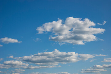 Blue sky with lots of thick clouds. Sky background.