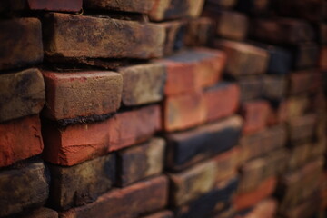 stack of old red and black bricks